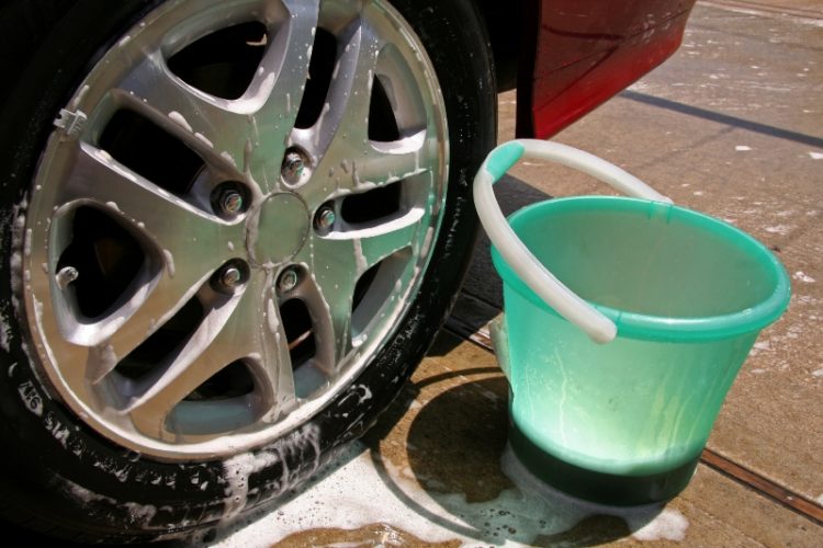 car tire with soap suds dripping down
