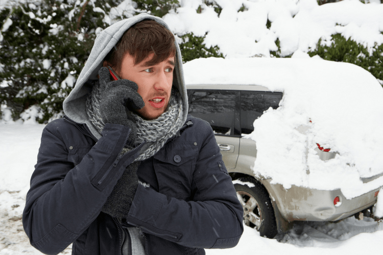 person calling for help to get car out of snowbank