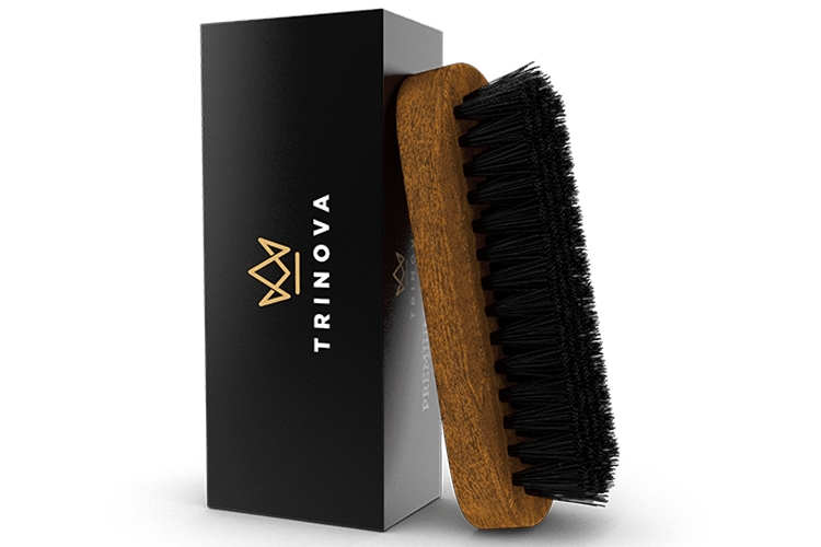 leather brush leaning against packaging material