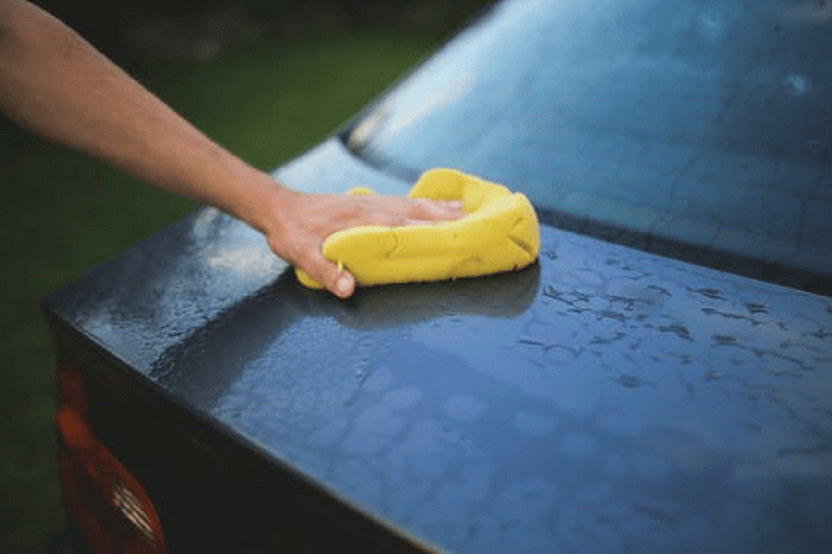 Make Care Detailing Fun: Fun for the whole family! Father showing the best way to wash a car.