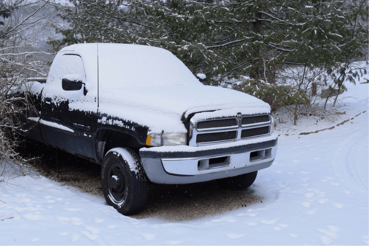 pickup truck covered in snow