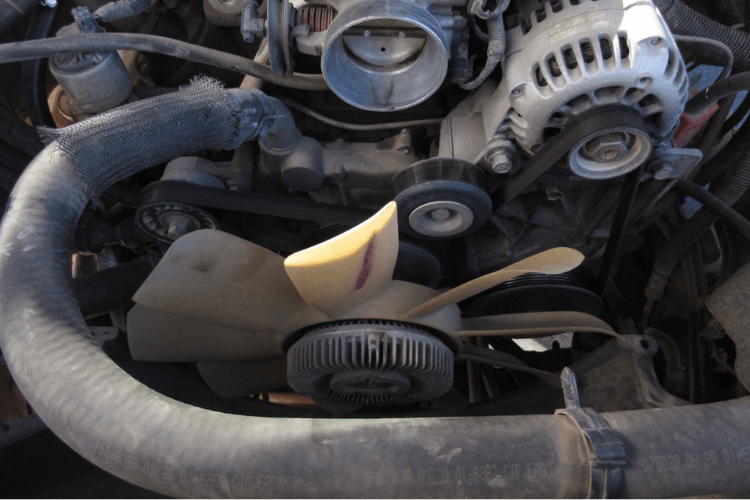 Some vehicles still use mechanical fans, mostly trucks. A mechanical fan does the same job as an electric fan, but they spin all the time. The device on the front is a fan clutch, this allows the fan to free-spin when the engine is cool.