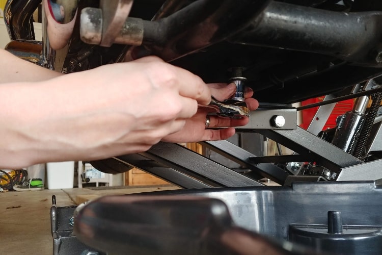 Carefully remove the oil pan drain bolt and set aside.