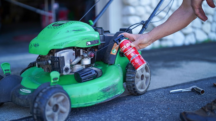 22001 In Use Spraying in air intake of lawn mower min