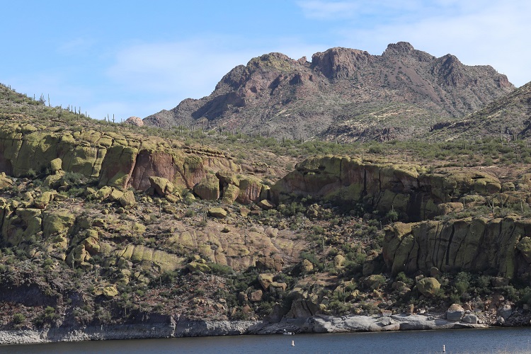 rock cliff overlooking lake