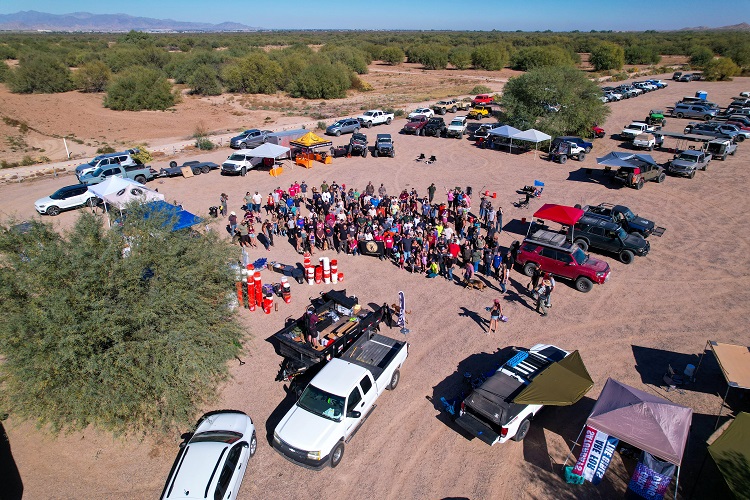 aerial view of people, trucks, and tents