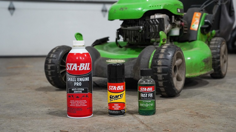 three products in front of a green lawn mower