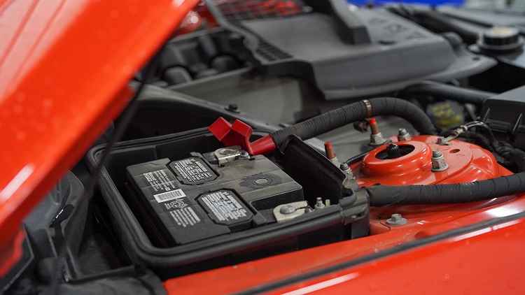 car battery under the hood of a car
