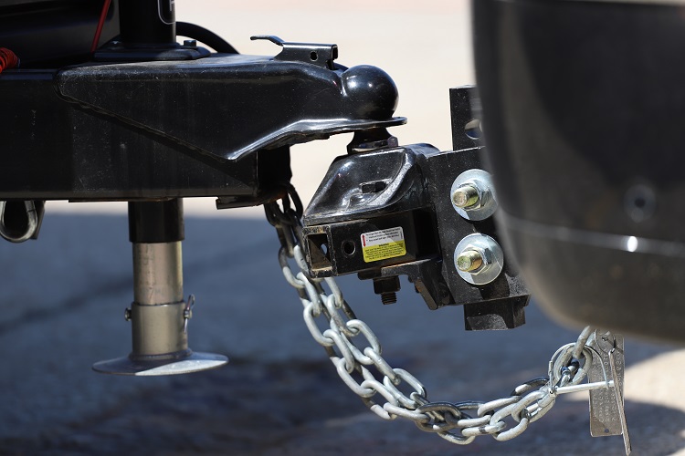 RV trailer hitch connected by chain