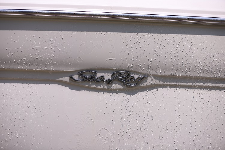 water sheeting off one half of boat surface while other half absorbs moisture
