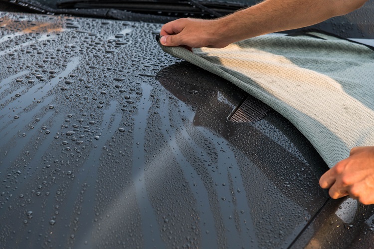 waffle weave towel laid atop a car surface