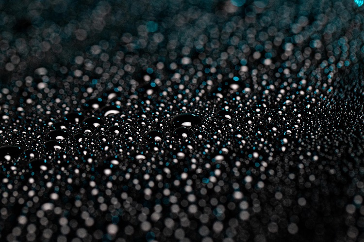 water beading on surface of car