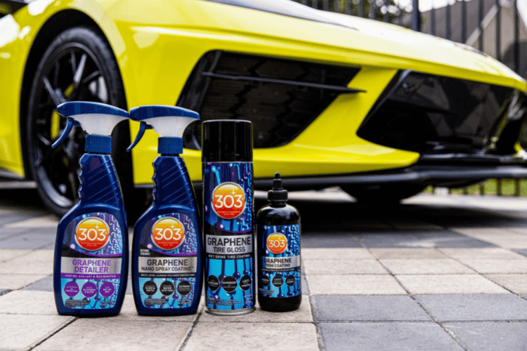 four detailing products in front of a sports car